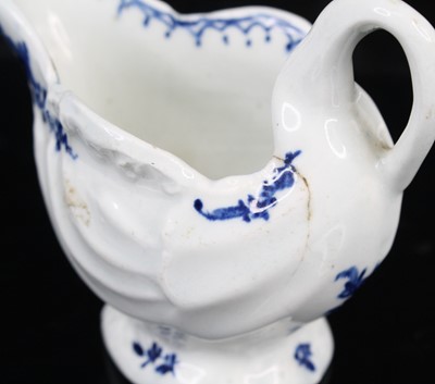Lot 1059 - A Lowestoft porcelain dolphin ewer cream jug,...