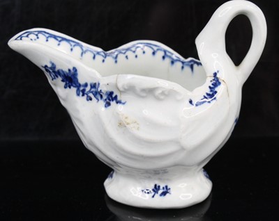 Lot 1059 - A Lowestoft porcelain dolphin ewer cream jug,...