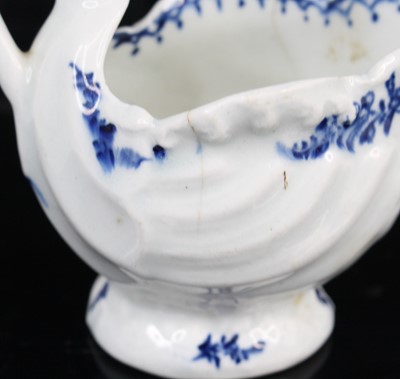 Lot 1059 - A Lowestoft porcelain dolphin ewer cream jug,...