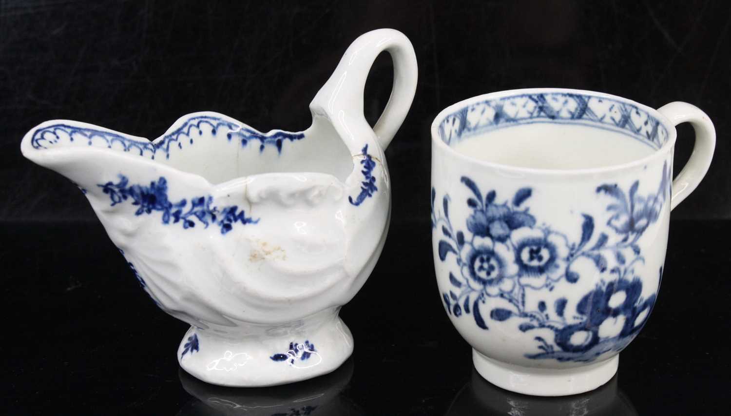 Lot 1059 - A Lowestoft porcelain dolphin ewer cream jug,...