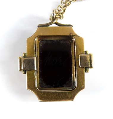 Lot 2735 - A carved carnelian pendant as a profile...