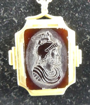 Lot 2735 - A carved carnelian pendant as a profile...
