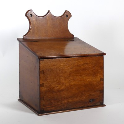 Lot 5 - A 19th century oak candle box, having a shaped...