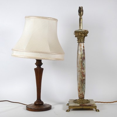 Lot 17 - A metal mounted onyx table lamp in the form of...