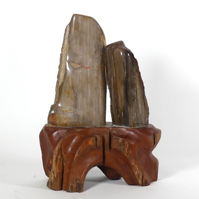 Lot 21 - Two sections of petrified wood, mounted to a...