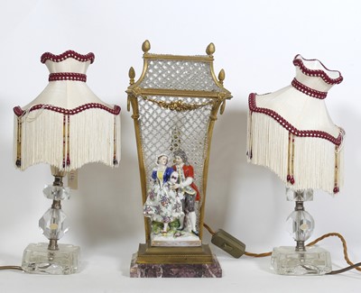 Lot 82 - A French figural table lamp, in the form of a...