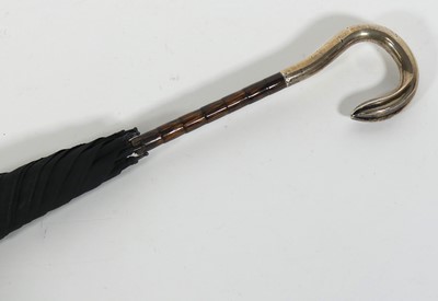 Lot 101 - An Edwardian umbrella having a silver mounted...