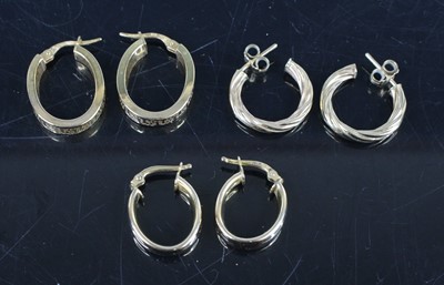 Lot 344 - Three pairs of modern 9ct hollow gold hoop...