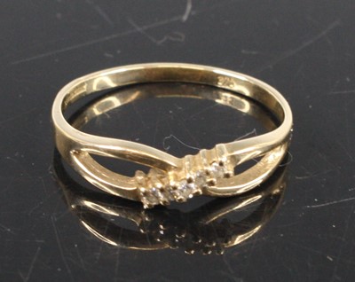 Lot 348 - A modern 9ct gold diamond crossover ring, set...