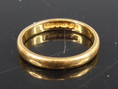 Lot 353 - A 22ct gold court shaped wedding band, sponsor...