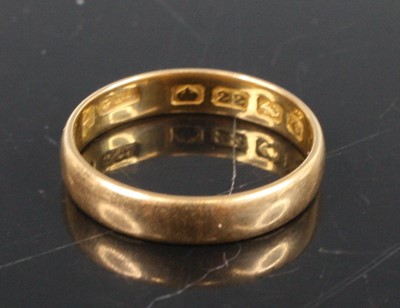 Lot 354 - A vintage court shaped 22ct gold wedding band,...