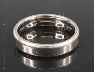 Lot 358 - A modern platinum wedding band, size S,...