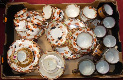 Lot 133 - A floral decorated part tea service; together...