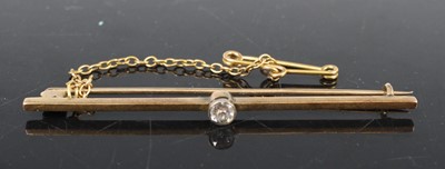 Lot 388 - A yellow metal diamond bar brooch, with safety...