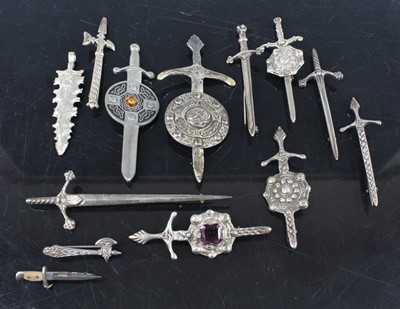 Lot 410 - A collection of silver and white metal bar...