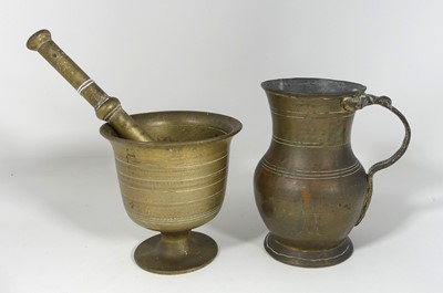 Lot 174 - An antique brass pestle and mortar, mortar...