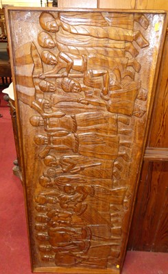 Lot 1124 - A West African relief carved and stained teak...