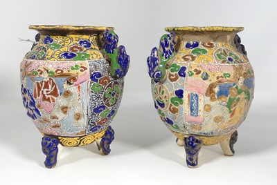 Lot 179 - A pair of Japanese enamel decorated pottery...