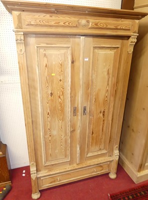 Lot 1133 - A French provincial pine double door armoire,...