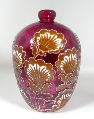 Lot 192 - A cranberry art glass vase having overlaid...