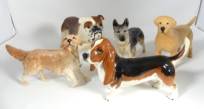 Lot 197 - A collection of five Beswick figures of dogs,...