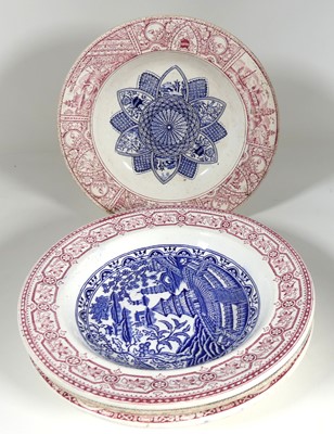 Lot 201 - A group of four transfer decorated plates by...