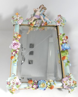 Lot 204 - A German floral encrusted porcelain framed...