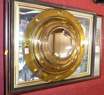 Lot 1075 - A graduated set of three brass porthole...