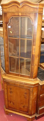 Lot 1189 - A reproduction yew wood freestanding corner...