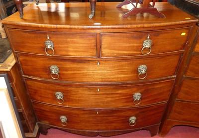 Lot 1194 - A Regency mahogany bowfront chest, of two...