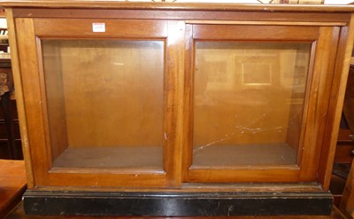 Lot 1195 - A mahogany double-door glazed table-top...