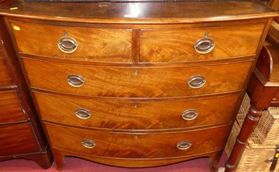 Lot 1196 - A Regency mahogany bowfront chest, of two...