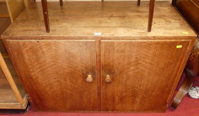 Lot 1207 - A 1930s walnut low double-door side cupboard,...