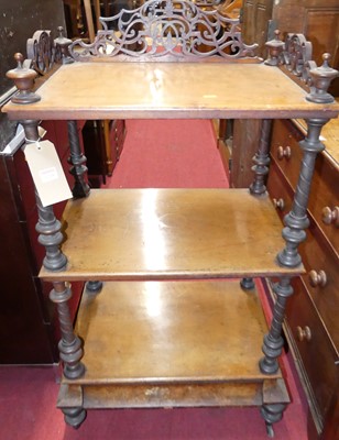 Lot 1218 - A mid-Victorian figured walnut three-tier...