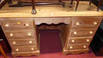 Lot 1231 - A modern pine kneehole dressing table, having...