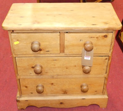 Lot 1236 - A small stained pine chest, of two short over...