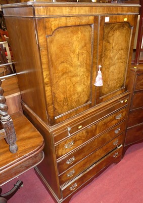 Lot 1245 - A 1930s figured walnut drinks cabinet, having...