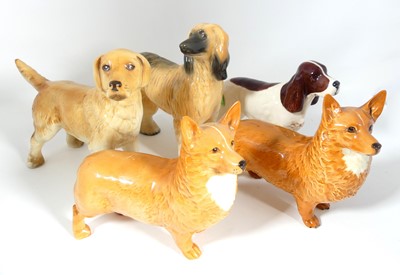 Lot 216 - Five various Beswick pottery figures of dogs...