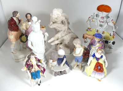 Lot 220 - A collection of ceramic figures to include...