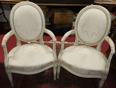 Lot 1308 - A pair of French white painted and floral...