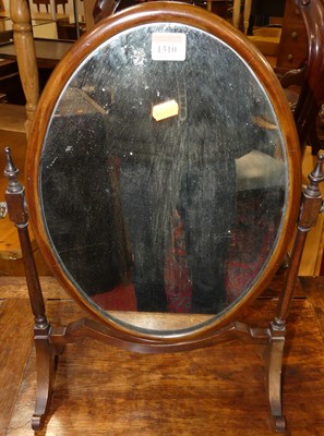 Lot 1310 - An Edwardian mahogany oval swing toilet mirror