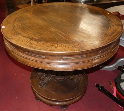 Lot 1315 - A Chinese stained elm circular pedestal centre...