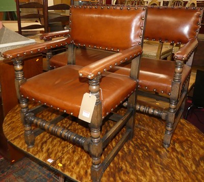 Lot 1324 - A joined oak tan leather upholstered and...