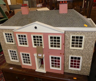 Lot 1327 - A two-storey dolls house, with hinged openings,...