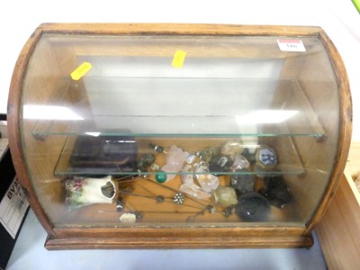 Lot 316 - A table top display cabinet having bowed glass...