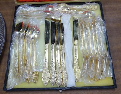 Lot 238 - An ornate gilt metal part canteen of cutlery,...