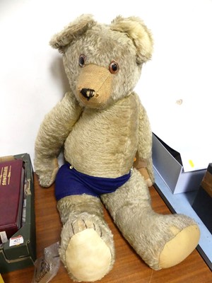 Lot 426 - A mid 20th century golden plush teddy bear of...