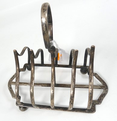 Lot 252 - A Victorian silver four-division toast rack,...