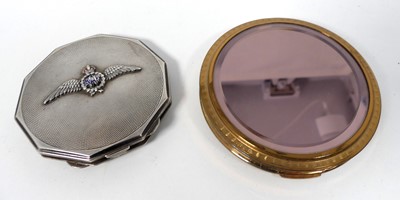 Lot 457 - An engine turned white metal powder compact,...