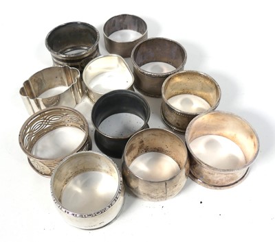 Lot 290 - A collection of ten silver napkin rings,...